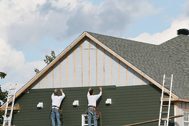 Professional Siding Replacement technician working in Whitsett, NC